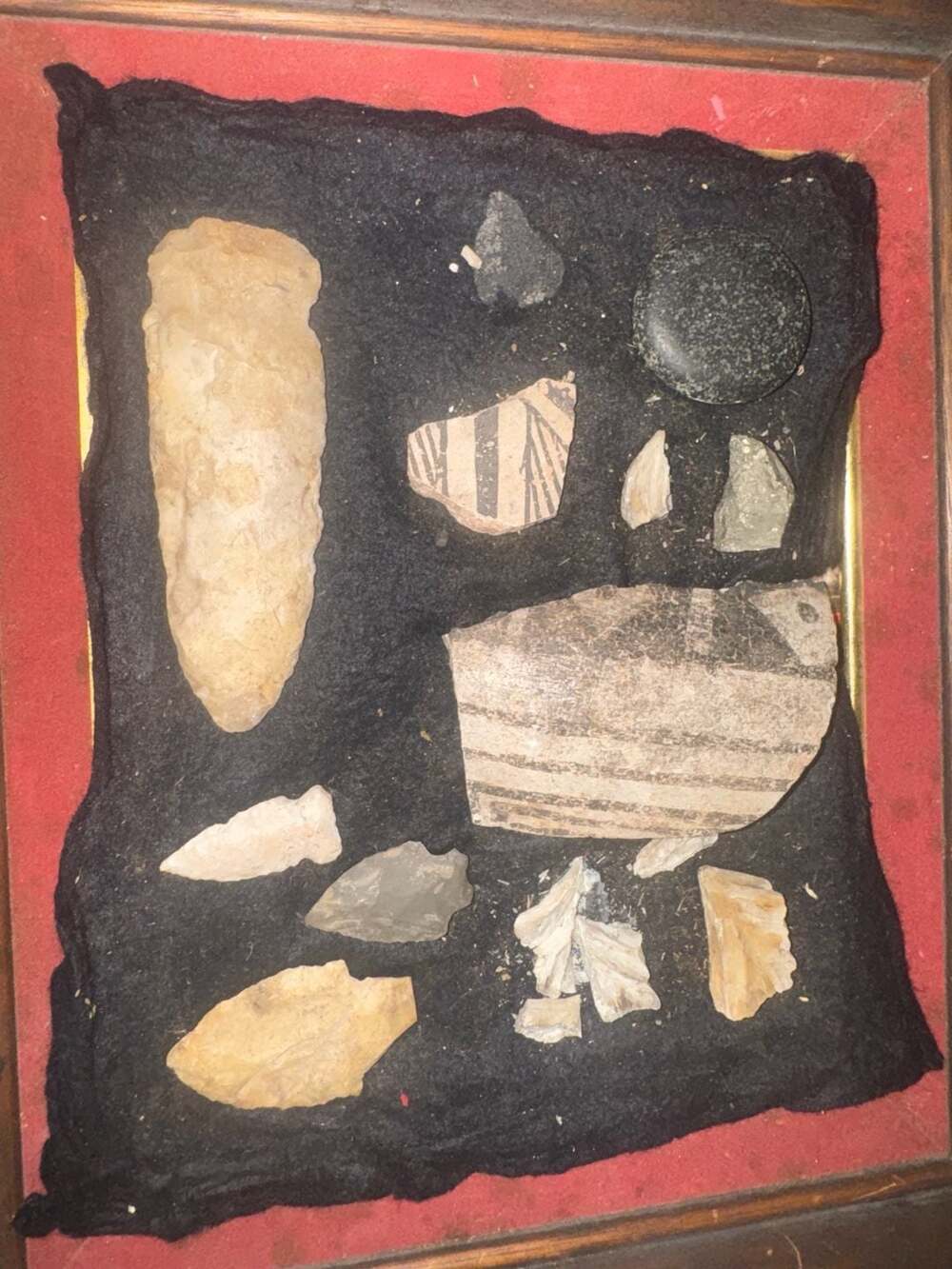 Framed Native American Artifact Collection Including Arrowheads and Pottery Shar